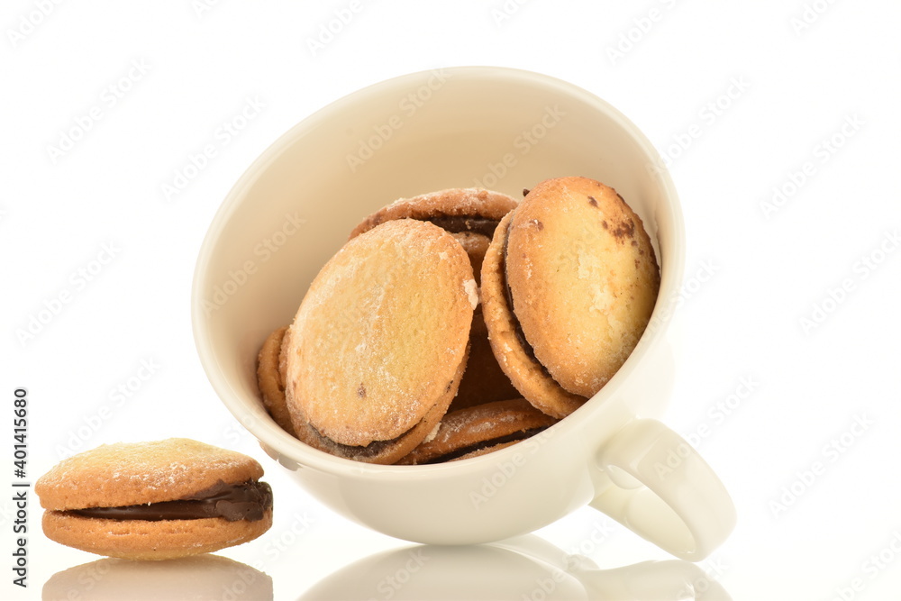Two delicious biscotti shortbread cookies with ceramic white cup, close-up, isolated on white. Two delicious biscotti shortbread cookies with ceramic white cup, close-up, isolated on white.
