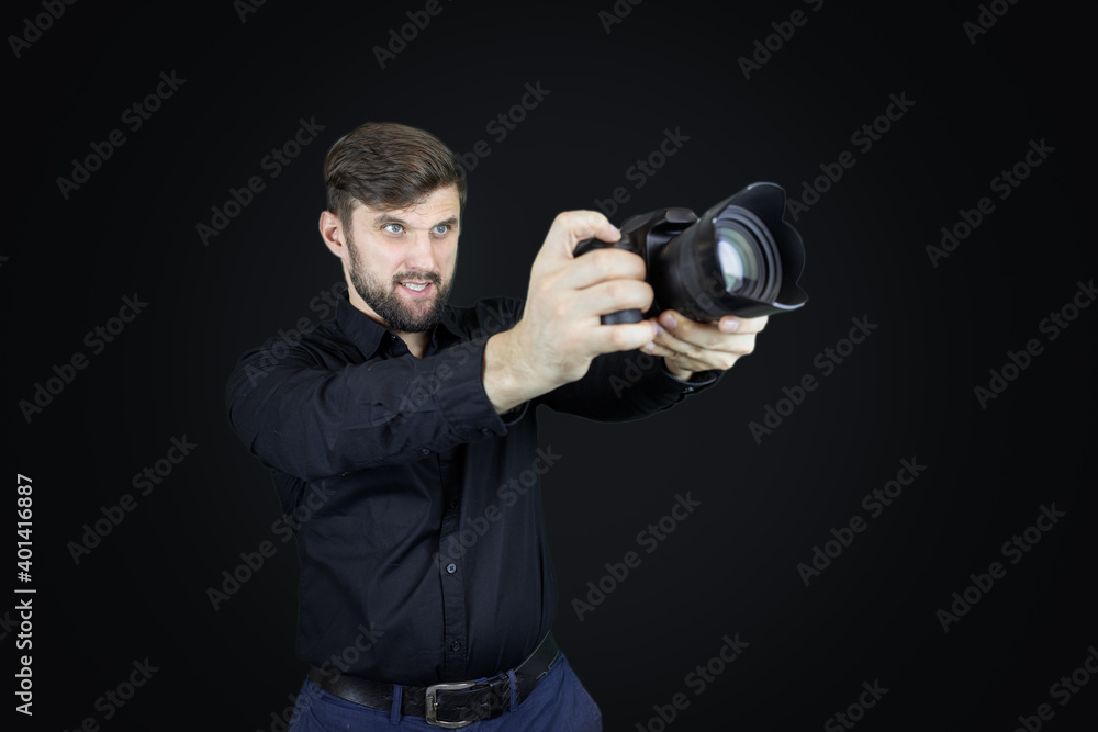 male photographer looks at digital camera display male photographer looks at digital camera display