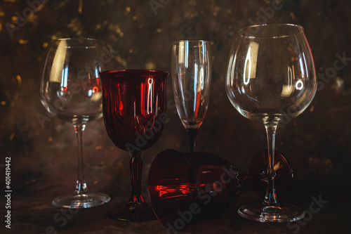new year and christmas background with different glasses on a dark background