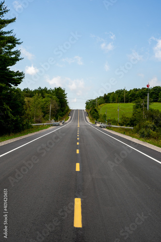 New paved highway through the summer countryside