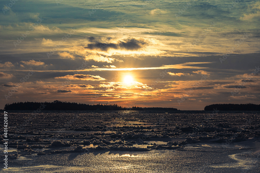 Sunset over frozen lake showing the Fishing Islands