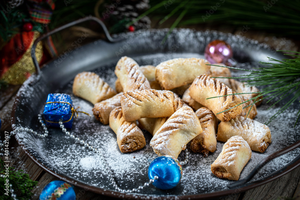 Peanut-filled cookies. Festive cookies for the new year, against the background of a Christmas tree and garlands