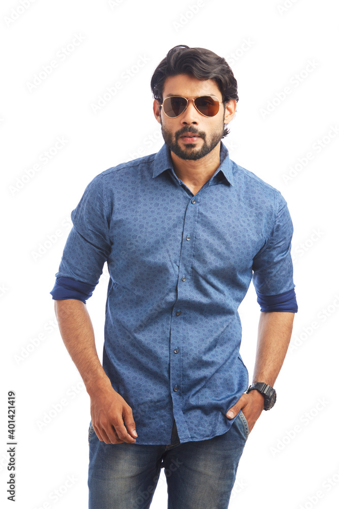 Fototapeta premium Happy smart young man posing with sunglasses