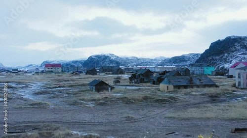 Panoramic aerial view of the abandoned fishing village with an abandoned fishing boat on the shore. Marine fishing in cold climates.