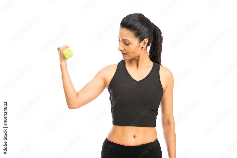 Healthy Indian woman with dumbbells working out on white background. fitness gym concept Healthy Indian woman with dumbbells working out on white background. fitness gym concept