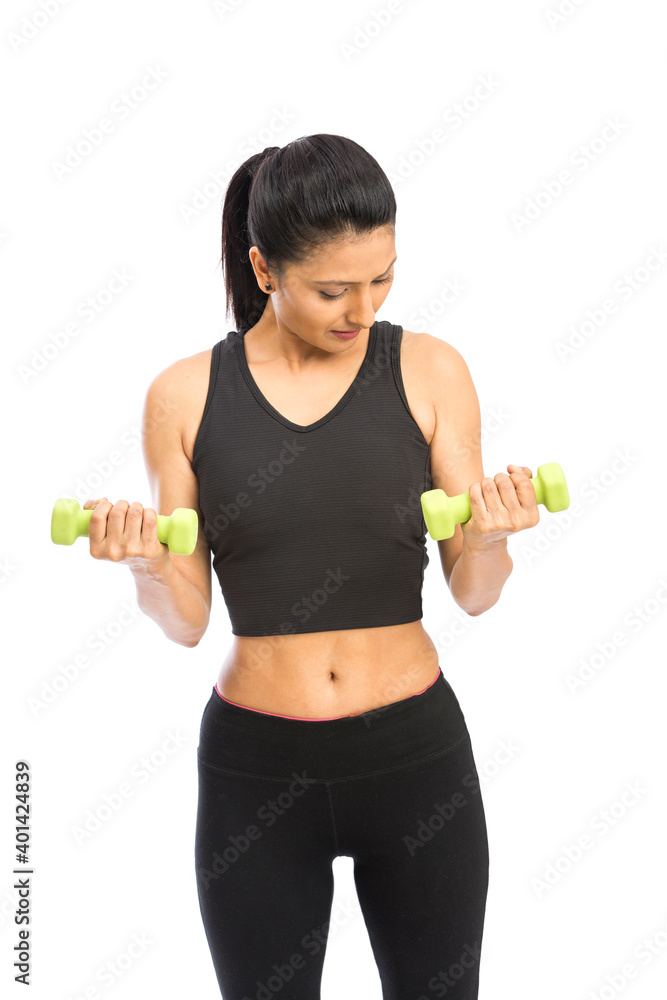 Healthy Indian woman with dumbbells working out on white background. fitness gym concept Healthy Indian woman with dumbbells working out on white background. fitness gym concept