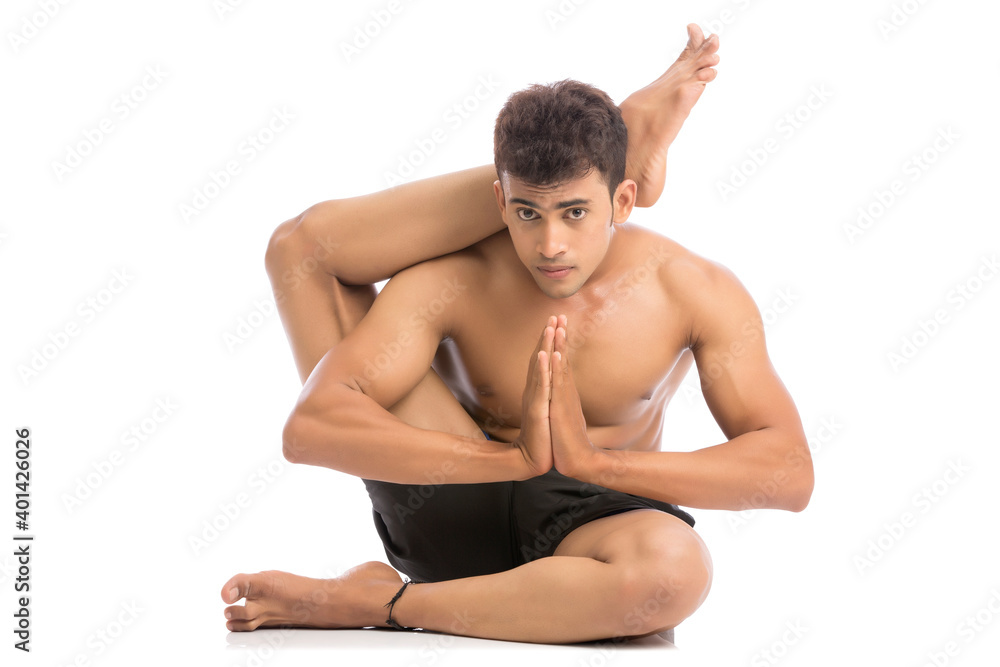 Young man is doing yoga isolated over white background Young man is doing yoga isolated over white background