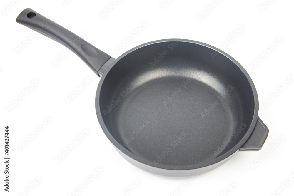 Black frying pan with non-stick teflon coating on white background Black frying pan with non-stick teflon coating on white background