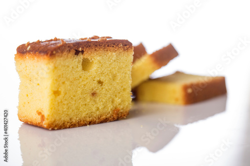 Butter cake sliced on white background