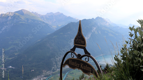 A view of the mountains and the Thunersee lake from the top of Interlaken, Harder Kulm at 1323 m height, in Switzerland. 