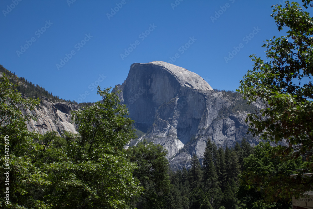 Amazing view of famous Yosemite Valley with rocks and river on a beautiful sunny day with blue sky in summer, Yosemite National Park, California, USA Amazing view of famous Yosemite Valley with rocks and river on a beautiful sunny day with blue sky in summer, Yosemite National Park, California, USA
