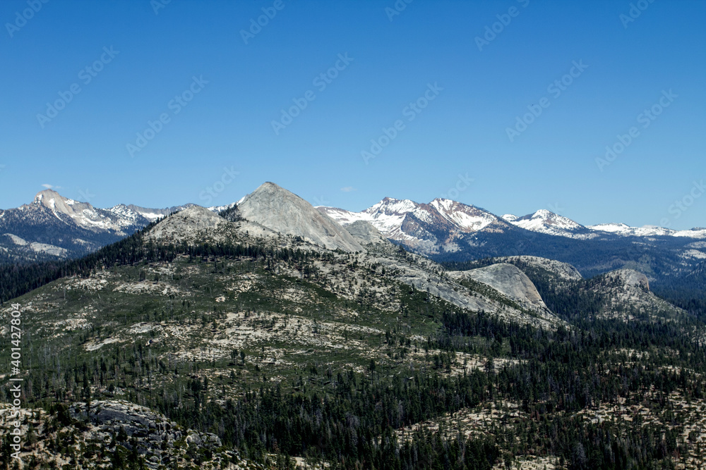Amazing view of famous Yosemite Valley with rocks and river on a beautiful sunny day with blue sky in summer, Yosemite National Park, California, USA Amazing view of famous Yosemite Valley with rocks and river on a beautiful sunny day with blue sky in summer, Yosemite National Park, California, USA