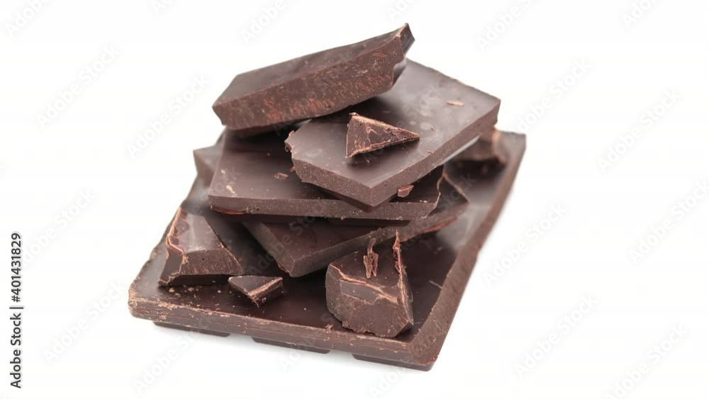 broken dark chocolate bar stack isolated on white background rotate. Confectionery, confection concept broken dark chocolate bar stack isolated on white background rotate. Confectionery, confection concept
