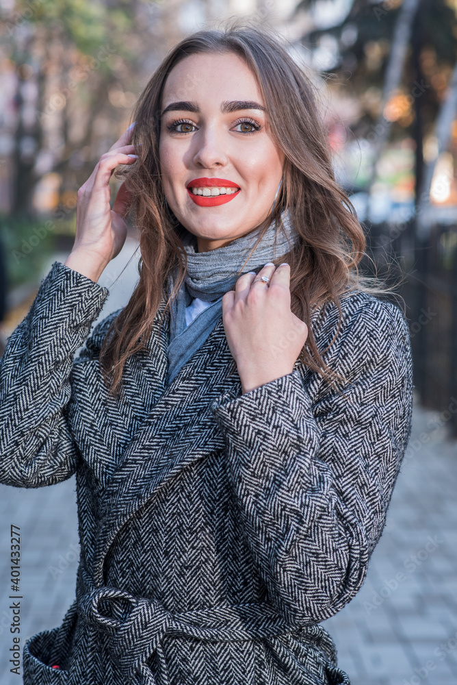 Portrait of a beautiful and happy girl outdoors. Beauty and fashion Portrait of a beautiful and happy girl outdoors. Beauty and fashion