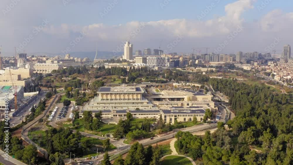 Aerial view of the Knesset, The Israeli house of Parliament, located in Jerusalem, with city rooftops in the horizon. Aerial view of the Knesset, The Israeli house of Parliament, located in Jerusalem, with city rooftops in the horizon.