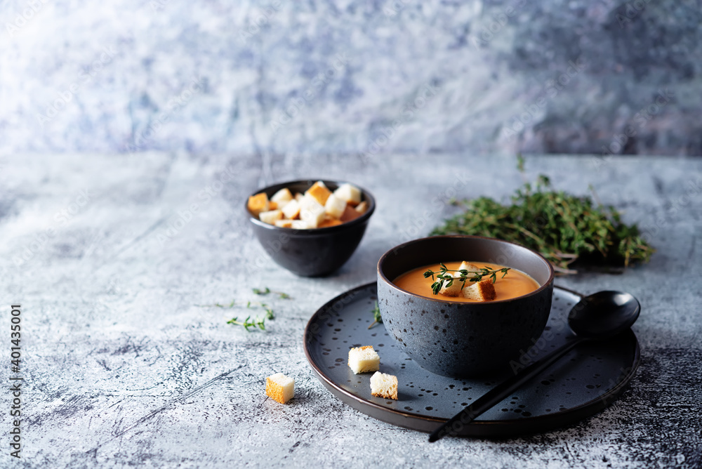 Sweet potato soup with croutons and thyme leaves Sweet potato soup with croutons and thyme leaves