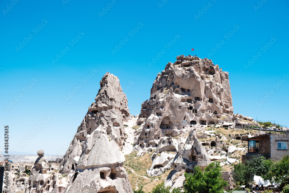Fototapeta premium An ancient city in Cappadocia. Stone houses in the rocks. Famous castles in Cappadocia with selective focus.