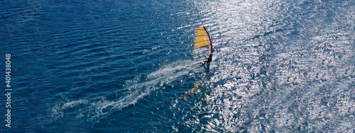 фотографія Aerial drone ultra wide photo of professional wind surfer practice in deep blue