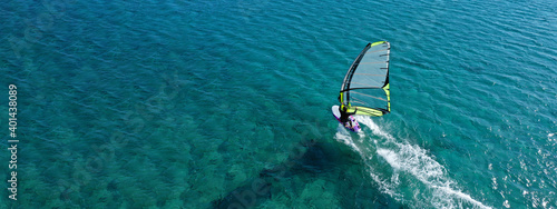 Aerial drone ultra wide photo of professional wind surfer practice in deep blue open ocean sea photo