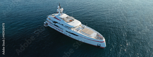Aerial drone ultra wide photo of luxurious yacht with wooden deck anchored in deep blue Mediterranean Sea © aerial-drone