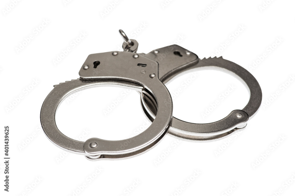 Pair of steel handcuffs isolated on white background. Silver metal handcuffs on white Pair of steel handcuffs isolated on white background. Silver metal handcuffs on white
