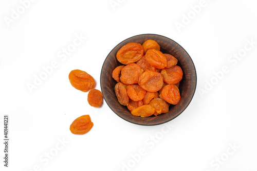 dried apricot delicious dried apricots in a plate on an isolated white background