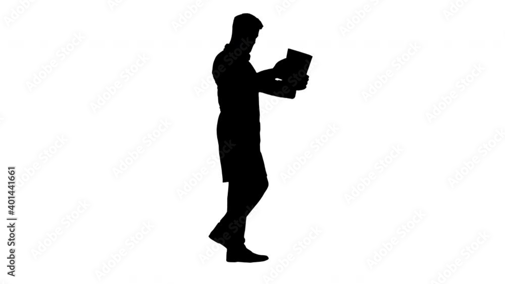 Male doctor walking and looking at cardiogram, Alpha Channel Male doctor walking and looking at cardiogram, Alpha Channel