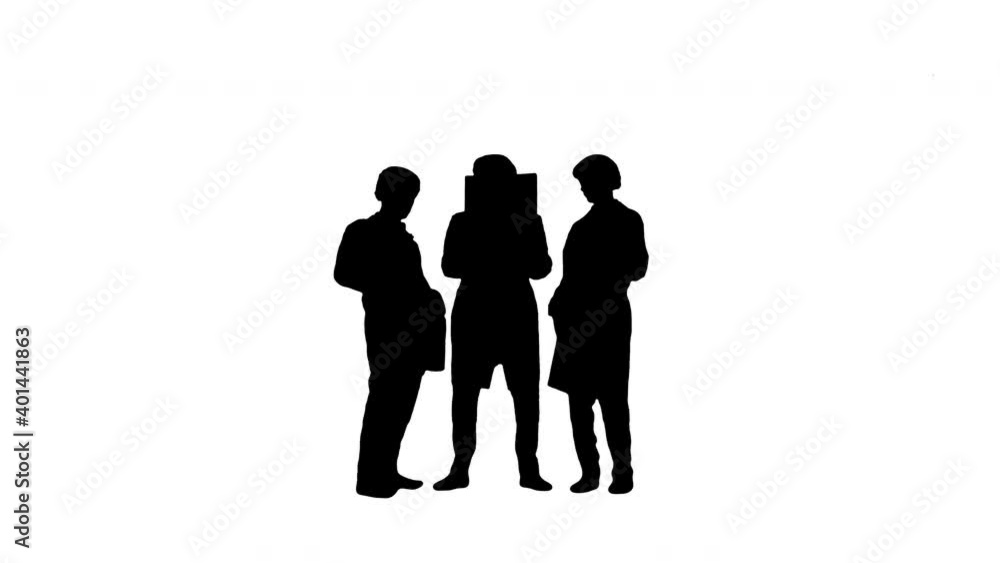 Silhouette Three male doctors in white robes and protective caps looking at computed tomography x-ray image and thinking at camera. Silhouette Three male doctors in white robes and protective caps looking at computed tomography x-ray image and thinking at camera.