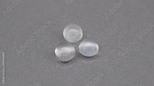 natural white moonstones adular gems on the background