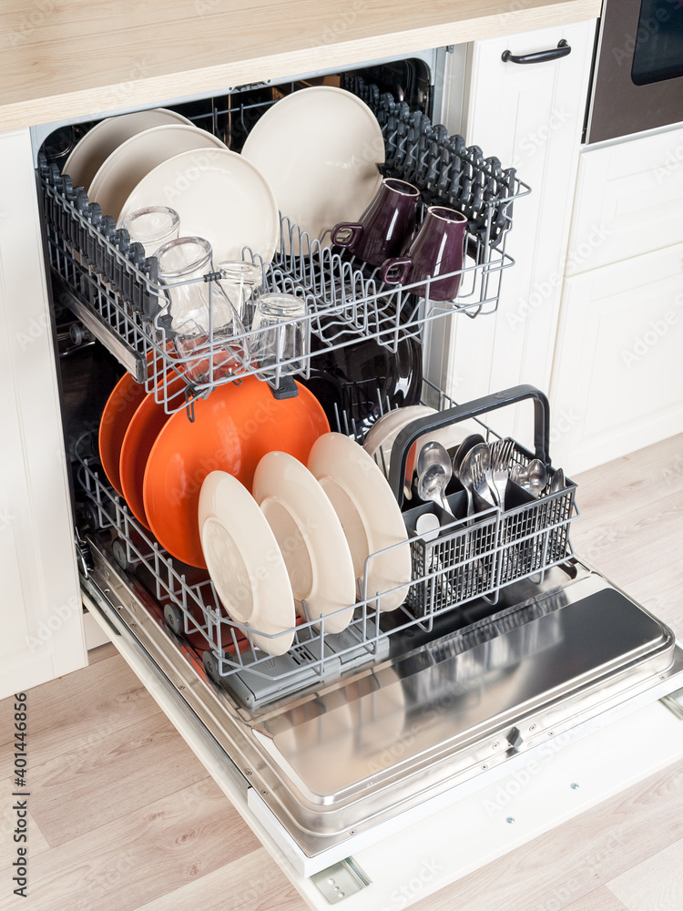 dishwasher close-up with washed dishes, easy to use and save water,  eco-friendly, built-in kitchen dish washing machine Stock Photo | Adobe  Stock