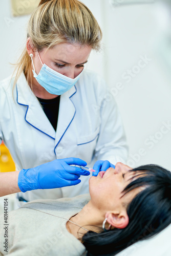 Lip Augmentation. Woman Getting Beauty Injection For Lips.