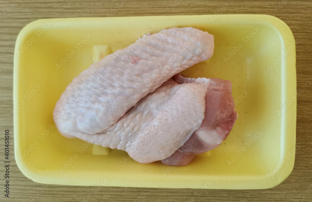 Single fresh raw turkey wing for cooking Single fresh raw turkey wing for cooking