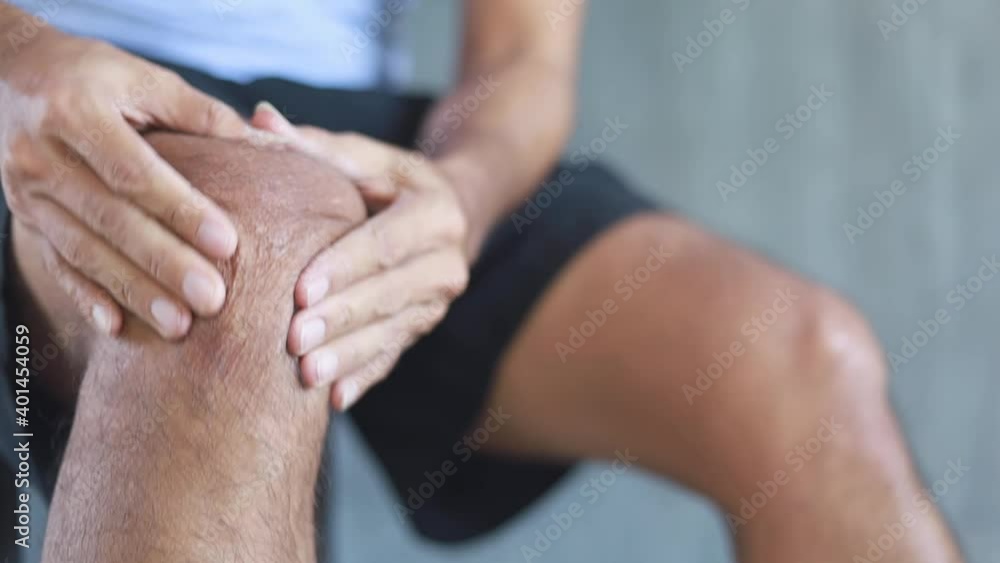 young man massage on his knee pain and feeling bad, Health problems young man massage on his knee pain and feeling bad, Health problems