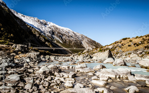 snow covered mountains and bridge. Trek to Mount Cook