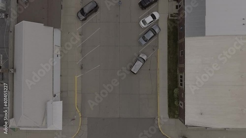 Car Pulling out of Angled Parking Space Aerial 2.7k photo