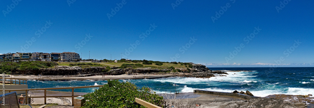 Stunning panoramic view of a deep blue sea from a coastal trail lookout, Sydney, New South Wales, Australia
