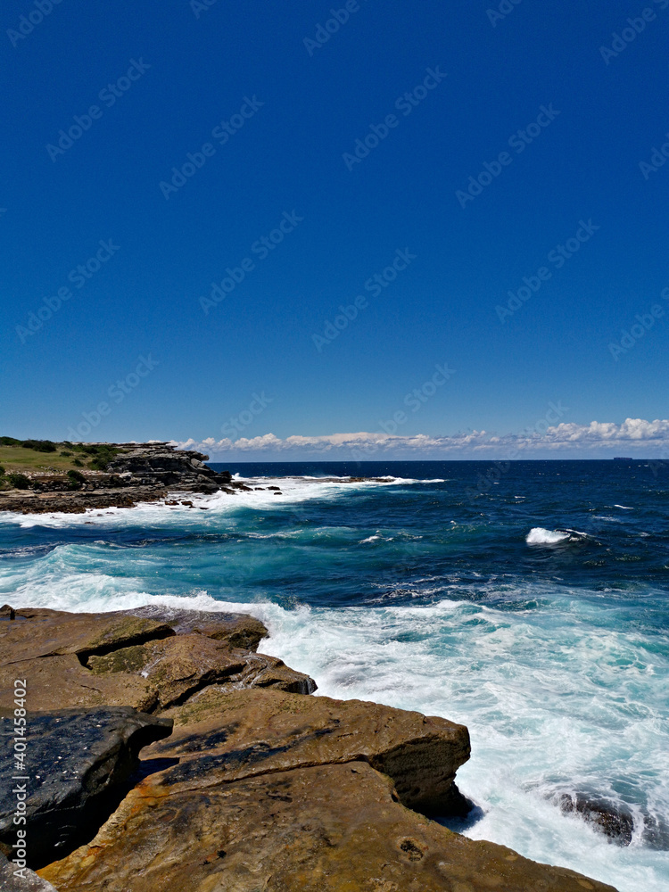 Stunning view of a deep blue sea from a coastal trail lookout, Sydney, New South Wales, Australia
Stunning view of a deep blue sea from a coastal trail lookout, Sydney, New South Wales, Australia
