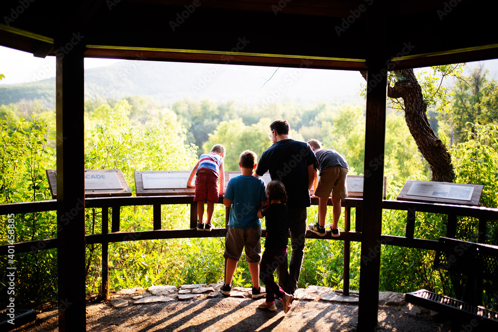 Dad hiking with small children Dad hiking with small children