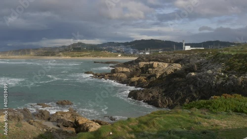 Industrial area next to a beach. photo