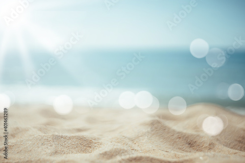 Fototapeta Naklejka Na Ścianę i Meble -  Blur tropical beach with bokeh sun light wave abstract background.
