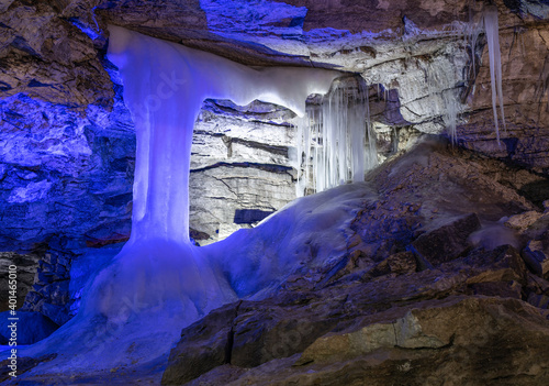 Entrance to ice cave with plenty of icicles. Kungur In The Urals, Russia photo