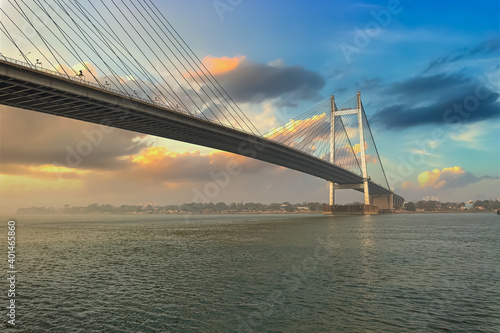 Vidyasagar Setu cable stayed bridge on river Ganges at Kolkata at sunset with moody sky. 