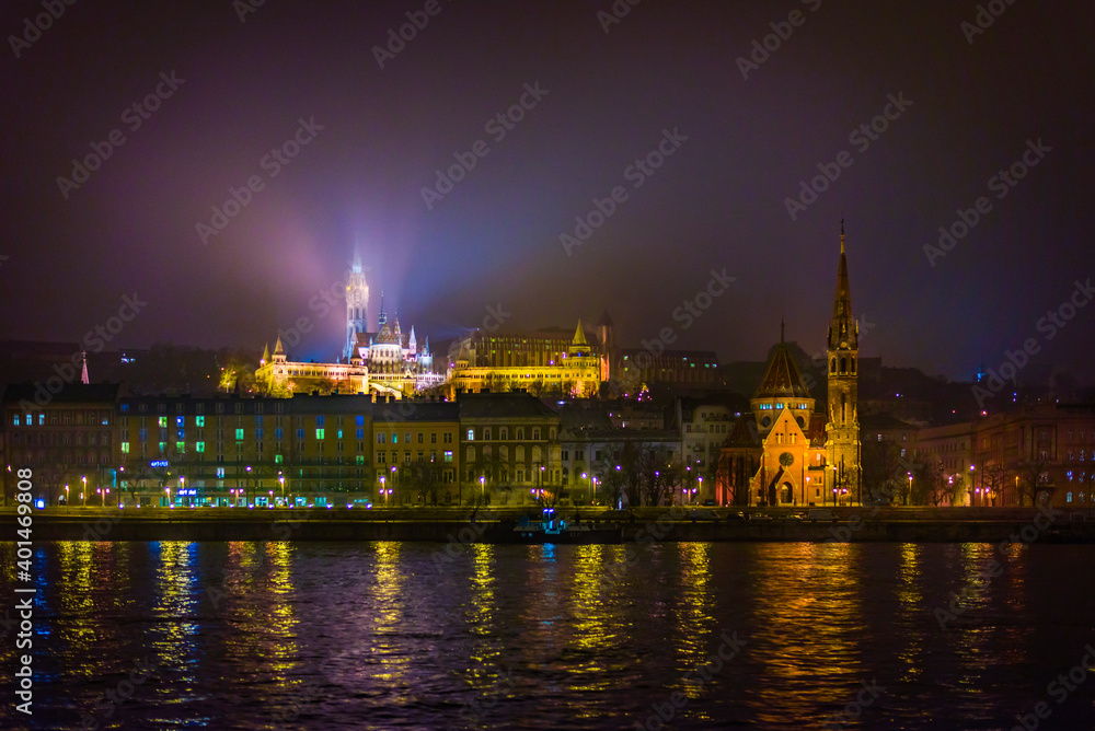 Obraz premium A view from ship on Budapest embankment at night.