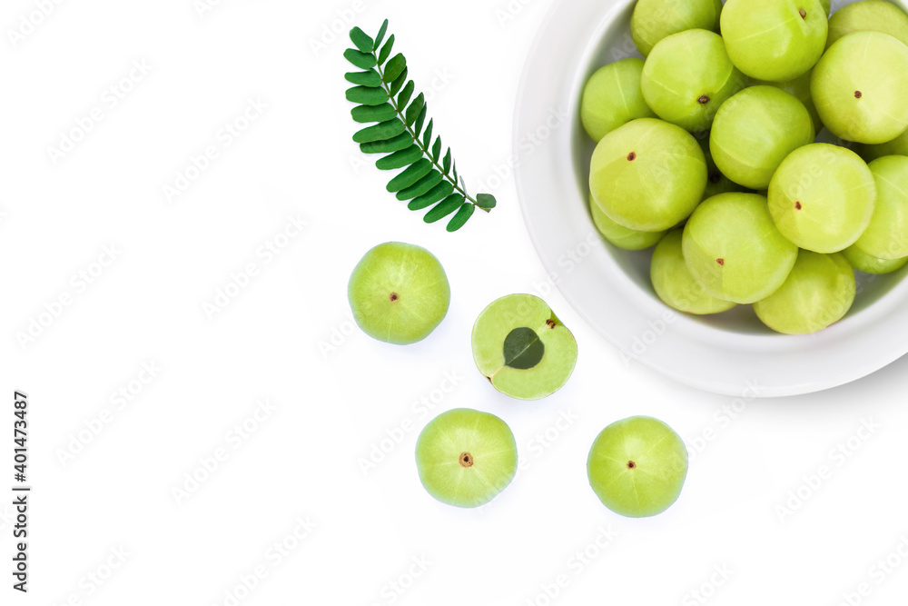 Indian gooseberry fruits ( phyllanthus emblica, amla ) with green leaf isolated on white 