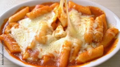 Korean rice cake in spicy Korean sauce with cheese, Cheese Tokpokki, Tteokbokki with Cheese - Korean food style photo