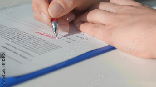 Wallpaper Mural A man crosses out what is written with a red helium pen Torontodigital.ca