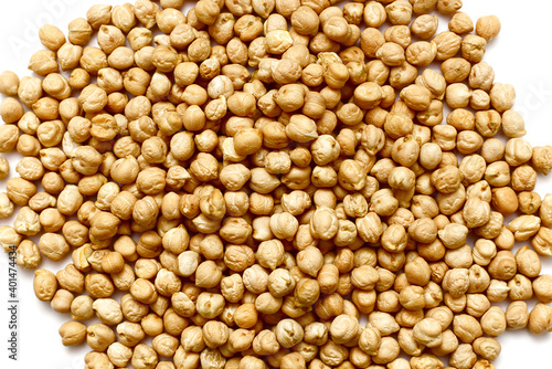 Raw, uncooked chickpeas isolated on a white background. Top view