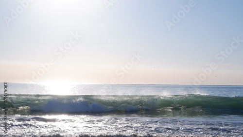 Pacific Ocean waves and sunlights