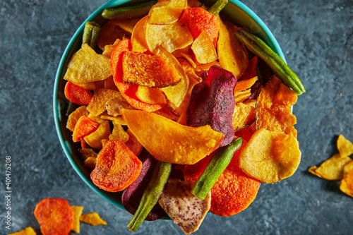 Dry fruit and Healthy vegetable chips  healthy vegan snack  a mixed heap  yellow sweet potato purple sweet potato carrot green radish green beans and shiitake mushrooms