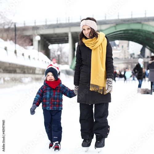 Mother and son skating down Ottawa rideau canal 